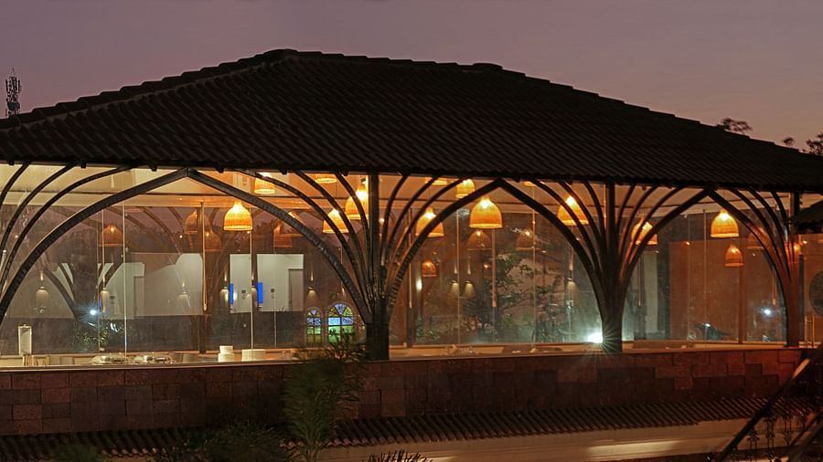 Flavours restaurant exterior view with warm light in Grand Continent, Anjuna - A Sarovar Portico Affiliate Hotel